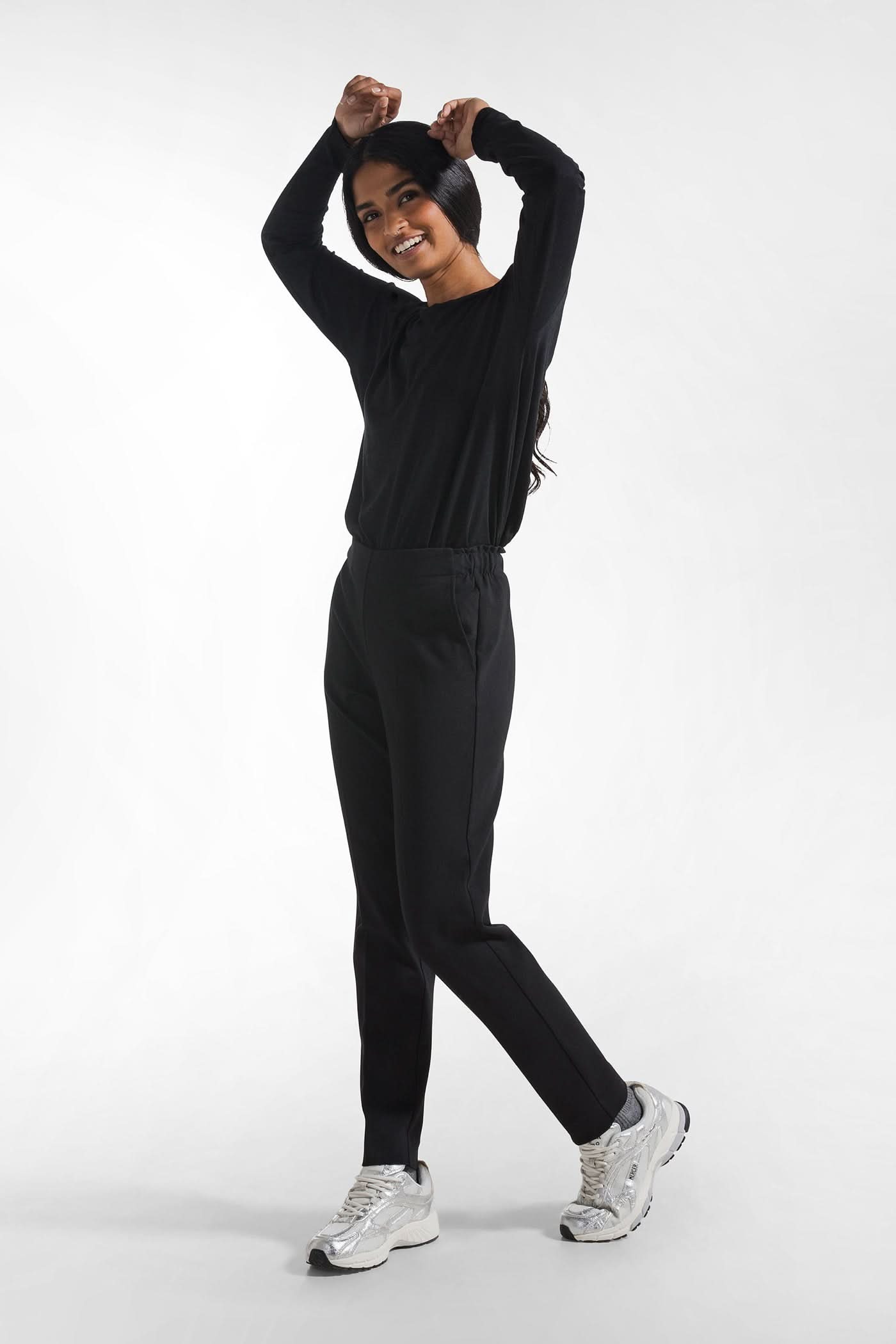 Black sweatpants with a crease