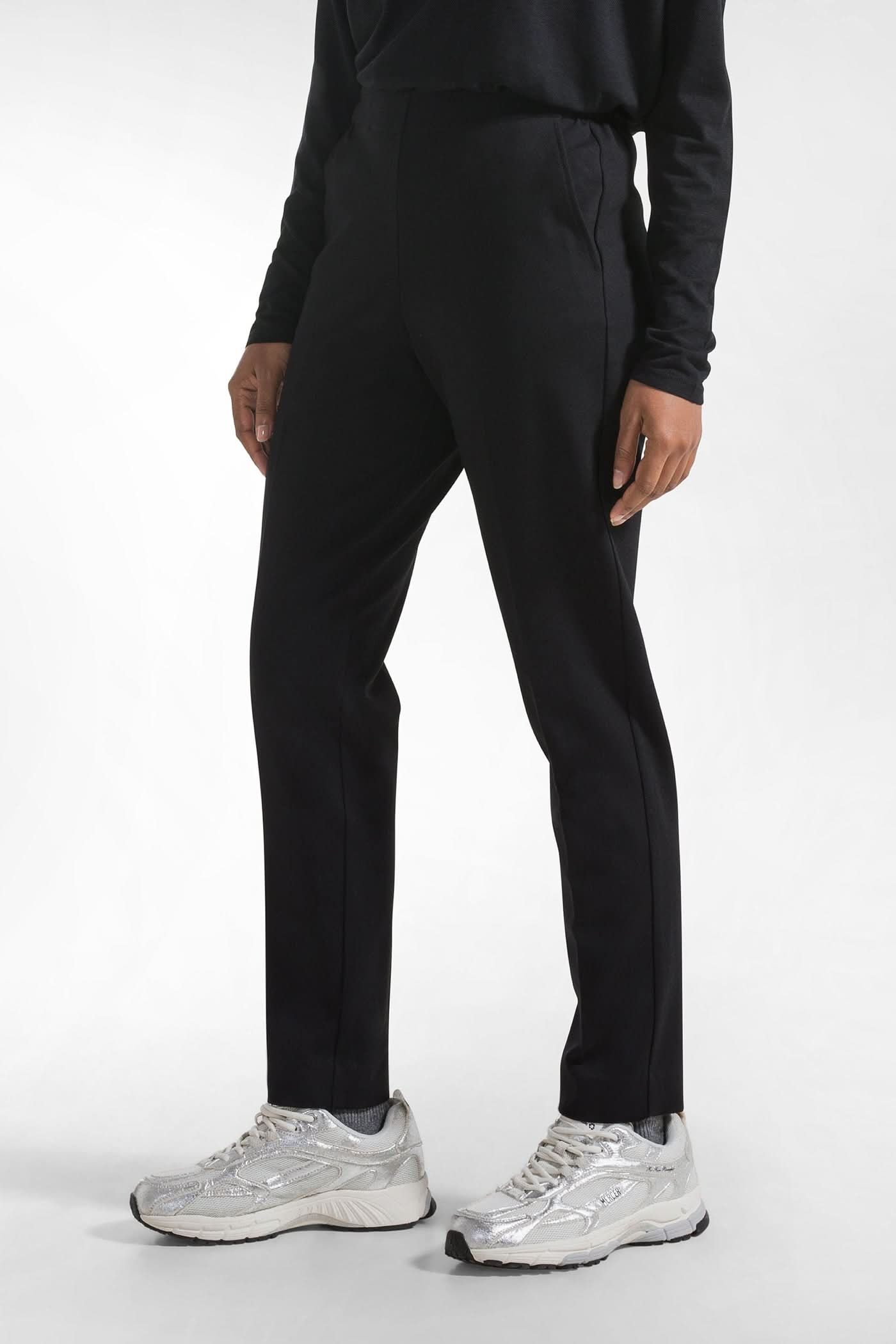 Black sweatpants with a crease