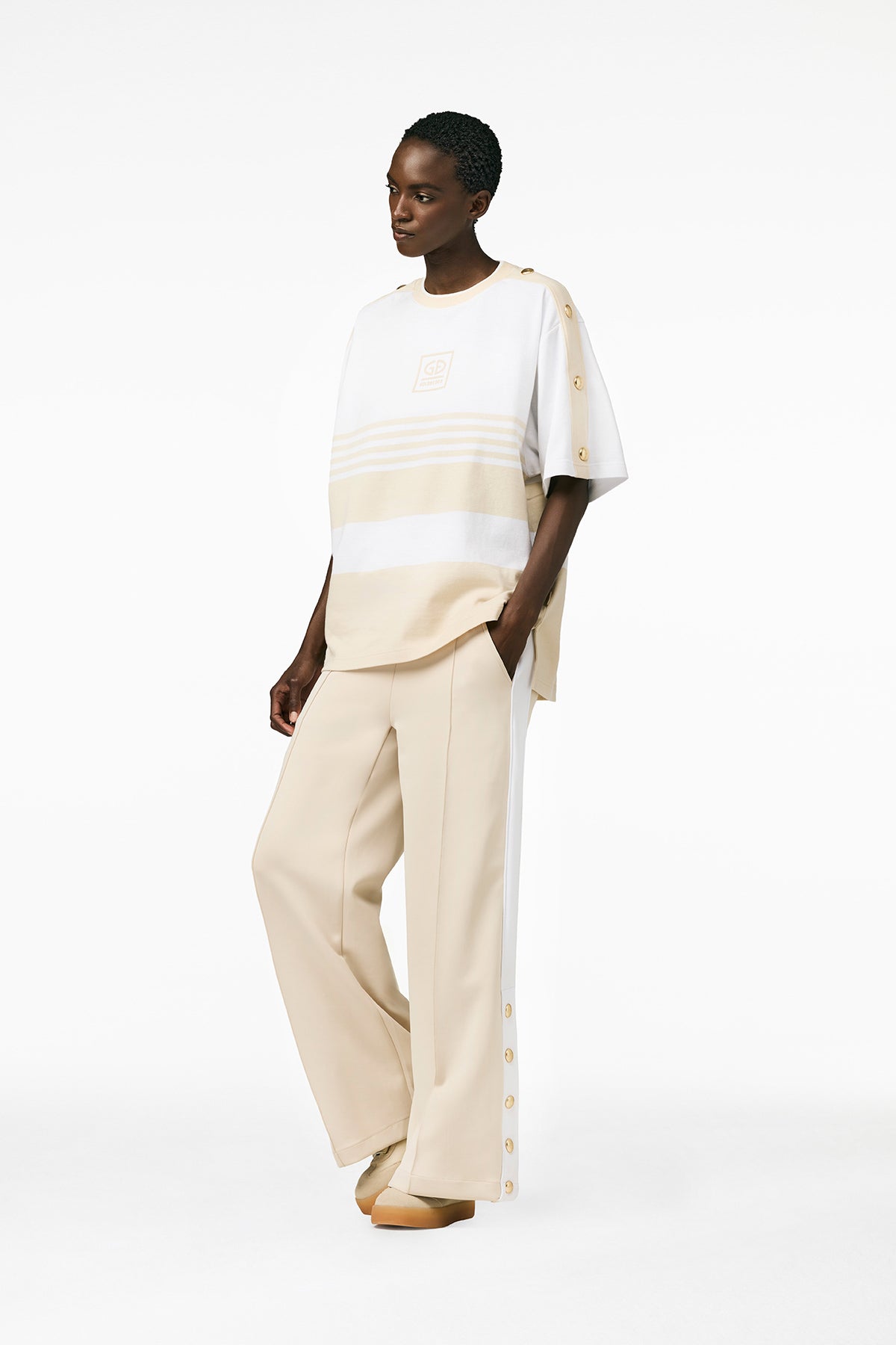 Jasnobeżowe spodnie GRIMAUD track pants