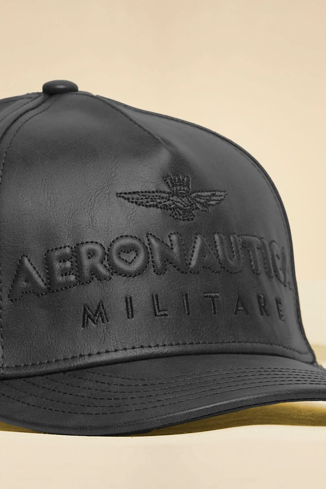 Black eco-leather cap with logo