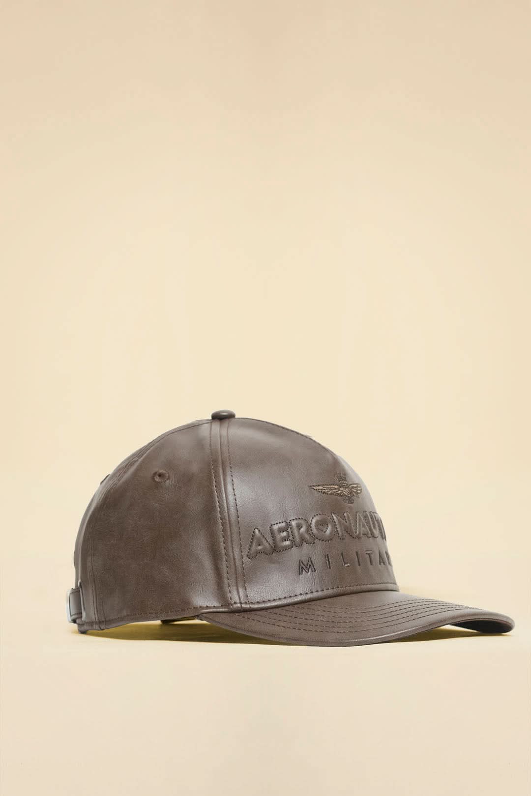 Brown eco-leather cap with logo