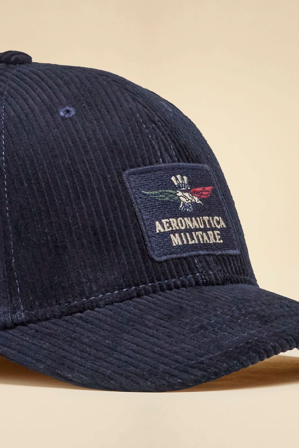 Navy blue ribbed velvet cap with eagle